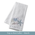 White cotton hand towel with embroidered starfish, shell and coral coastal design