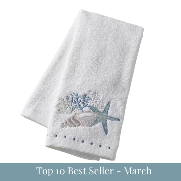 White cotton hand towel with embroidered starfish, shell and coral coastal design