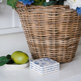 Shell Coasters Set of 4 styled on a white kitchen benchtop beside a woven basket and lemons, featuring blue coastal shell ceramic coasters for Hamptons style homes.