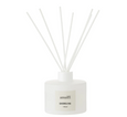 White glass reed diffuser with fibre sticks and Shoreline label