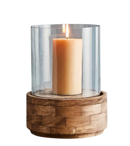 Small Amalfi hurricane lamp with dark natural wooden base and clear glass styled on a dining table
