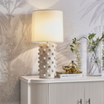 Close-up of the Smith table lamp featuring hand-applied textured ceramic detailing inspired by nature.
