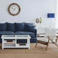 White Hamptons console table with cross-detail design and practical storage for hallways and living rooms