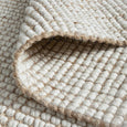 Sorrento Natural Wool & Jute Rug styled with neutral furniture in a coastal interior
