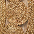 Handwoven jute spiral and circular weave detail on natural round rug