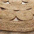 Close-up of handwoven natural jute texture on Spiral Round Rug