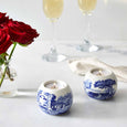 Spode Blue Italian tealight holders lit with candles and styled on an elegant dining table