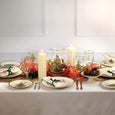 Spode Christmas Tree Christmas table setting featuring cake plate, festive dinnerware, glassware and holiday decorations styled for Christmas entertaining.