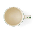 Top view of Spode Christmas Tree mug showing cream interior and festive mistletoe decoration.