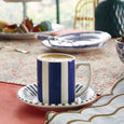 Spode Steccato espresso cup and saucer styled with coffee on a beautifully layered table setting.