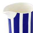 Close-up detail of the Spode Steccato milk jug highlighting the bold blue stripe design and pouring spout.