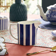 Spode Steccato milk jug styled on a beautifully set table with coordinating blue and white Spode tableware.
