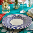 Spode Steccato salad plate styled on a colourful contemporary dining table.