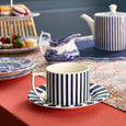 Spode Steccato teacup and saucer styled with Blue Italian tableware for elegant afternoon tea.
