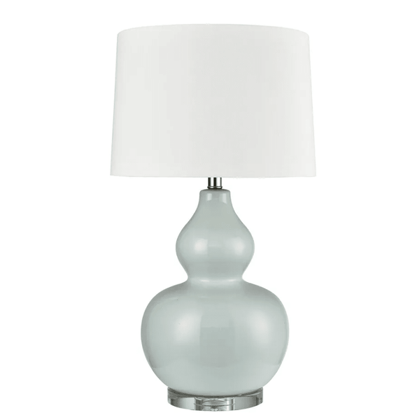 Sutton light blue ceramic table lamp with white shade styled in a Hamptons bedroom