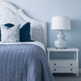 Close-up of Sutton ceramic table lamp base with white fabric shade

