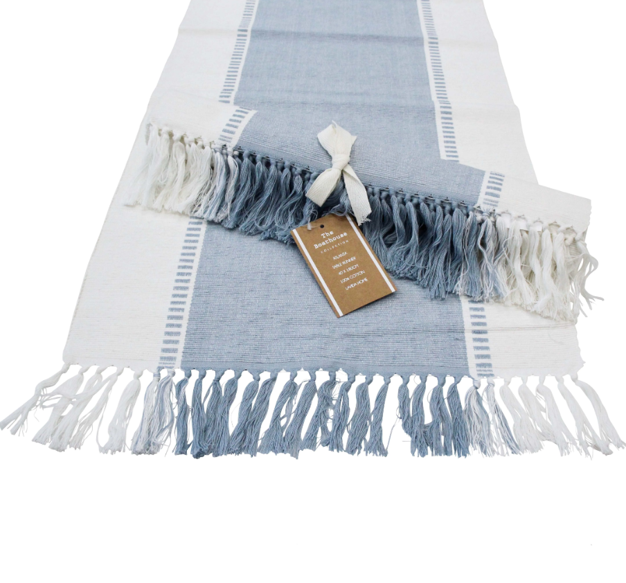 Table Runner Atlanta Chambray Blue cotton table runner with white border and blue and white tassel fringe.
