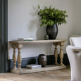 Vancouver natural timber console table styled with greenery, decorative books and ceramics in a modern Hamptons living space.