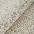 Detailed view of Veil Blue transitional rug with softly distressed blue and neutral motif
