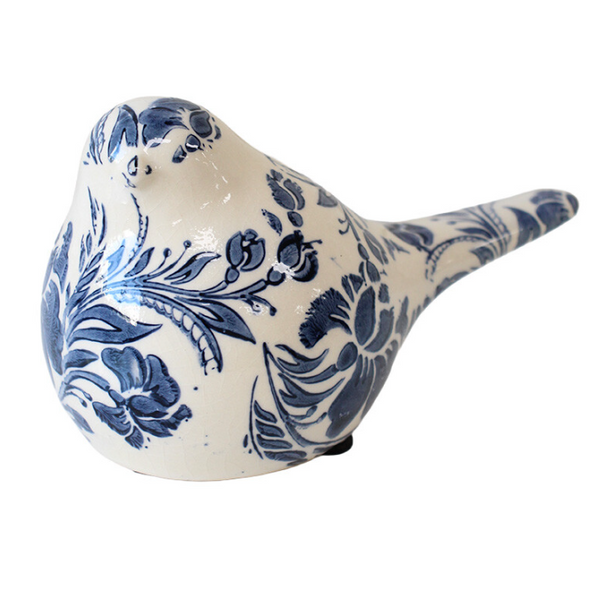 Ceramic bird figurine with blue floral patterns on a white background