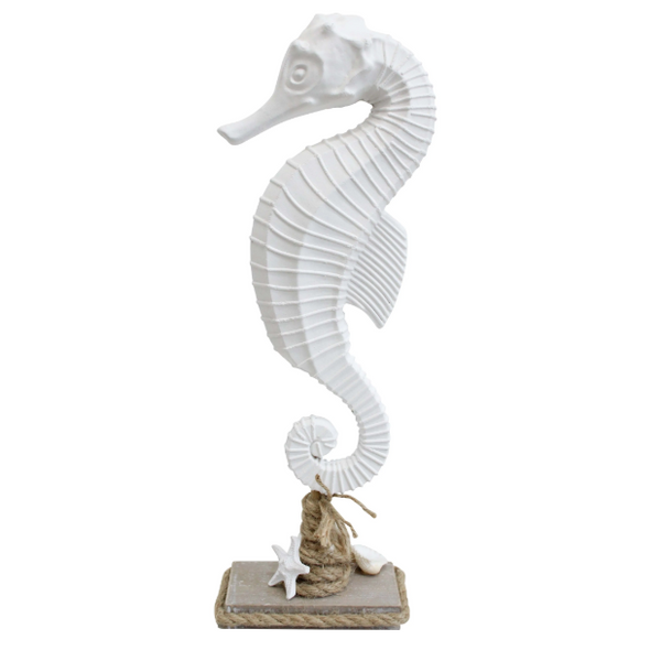 White coastal seahorse sculpture on a decorative rope-wrapped stand with shell and starfish accents, perfect for Hamptons and beach house home styling.
