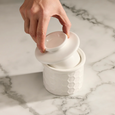 Wildflower & Hive butter bell opened to show white dolomite base and lid insert