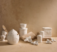 Wildflower and Hive ceramic kitchen collection styled on a rustic countertop with bee-inspired details