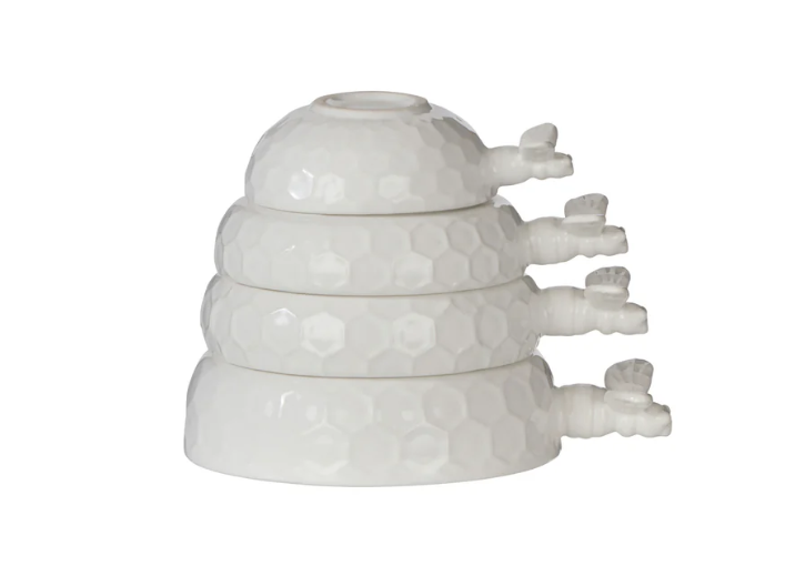 Wildflower & Hive white bee measuring cup set stacked together with honeycomb texture detail