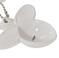 Close-up detail of Wildflower & Hive white bee measuring spoon with embossed wing design