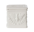 White ceramic salt cellar with embossed bee detail and lid