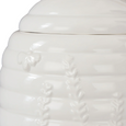 Close-up detail of Wildflower & Hive white storage jar with embossed honeycomb pattern