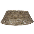 large washed grey wicker tree skirt placed under Christmas tree for rustic festive styling
