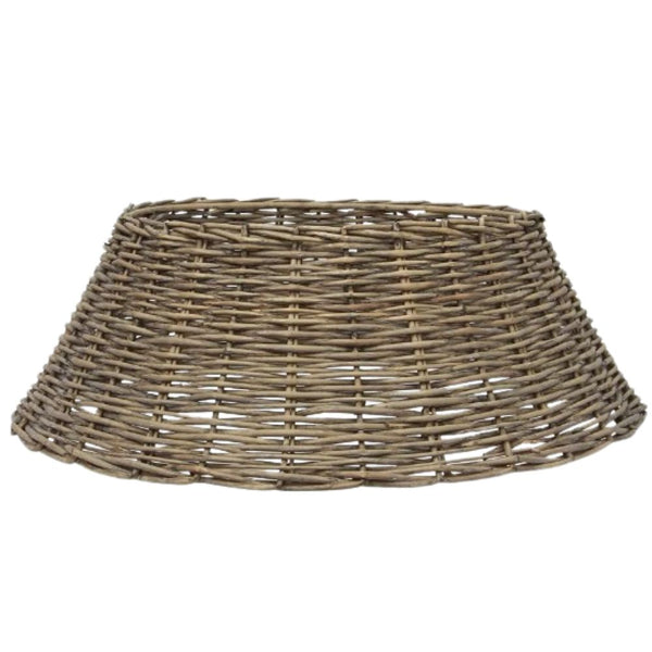 large washed grey wicker tree skirt placed under Christmas tree for rustic festive styling