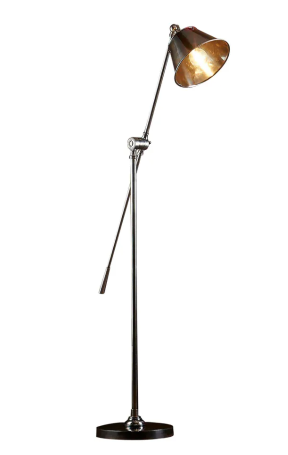 Winslow adjustable brass floor lamp beside sofa in elegant living room
