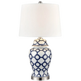 Blue and white coastal table lamp styled in elegant living room interior
