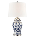 Blue and white coastal table lamp styled in elegant living room interior
