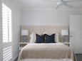 Winton Jar Shaped Table Lamp Small styled on bedside table in Hamptons bedroom
