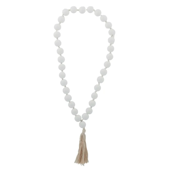 White wooden hanging beads with natural tassel for coastal home styling.