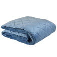 Allure Ocean blue velvet comforter folded, showing quilted texture and soft finish