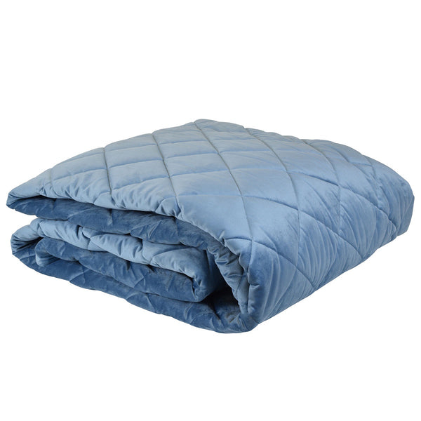 Allure Ocean blue velvet comforter folded, showing quilted texture and soft finish