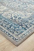 Rectangular Bridgeport Blue rug with classic distressed blue and ivory pattern, shown on a timber floor