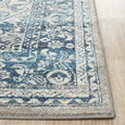 Rectangular Bridgeport Blue rug with classic distressed blue and ivory pattern, shown on a timber floor