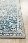 Rectangular Bridgeport Blue rug with classic distressed blue and ivory pattern, shown on a timber floor