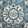 Rectangular Bridgeport Blue rug with classic distressed blue and ivory pattern, shown on a timber floor