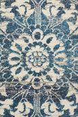 Rectangular Bridgeport Blue rug with classic distressed blue and ivory pattern, shown on a timber floor
