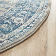 Round blue and ivory rug with classic distressed pattern, Bridgeport Blue Rug Round shown on a light timber floor