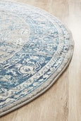 Round blue and ivory rug with classic distressed pattern, Bridgeport Blue Rug Round shown on a light timber floor