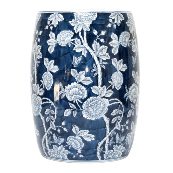 A ceramic garden stool with a blue and white floral pattern.