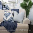East Hampton Sofa in flax fabric with contrast white piping and skirted base
East Hampton Sofa styled in a Hamptons living room with blue and white décor