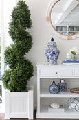 White PVC planter box with topiary plant in Hamptons living room